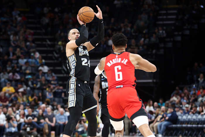 Dillon Brooks shoots over the top of Rockets' K.J. Martin.